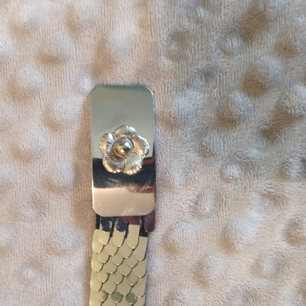 Brand New Belt (30 inches long) Flower detail on belt.
